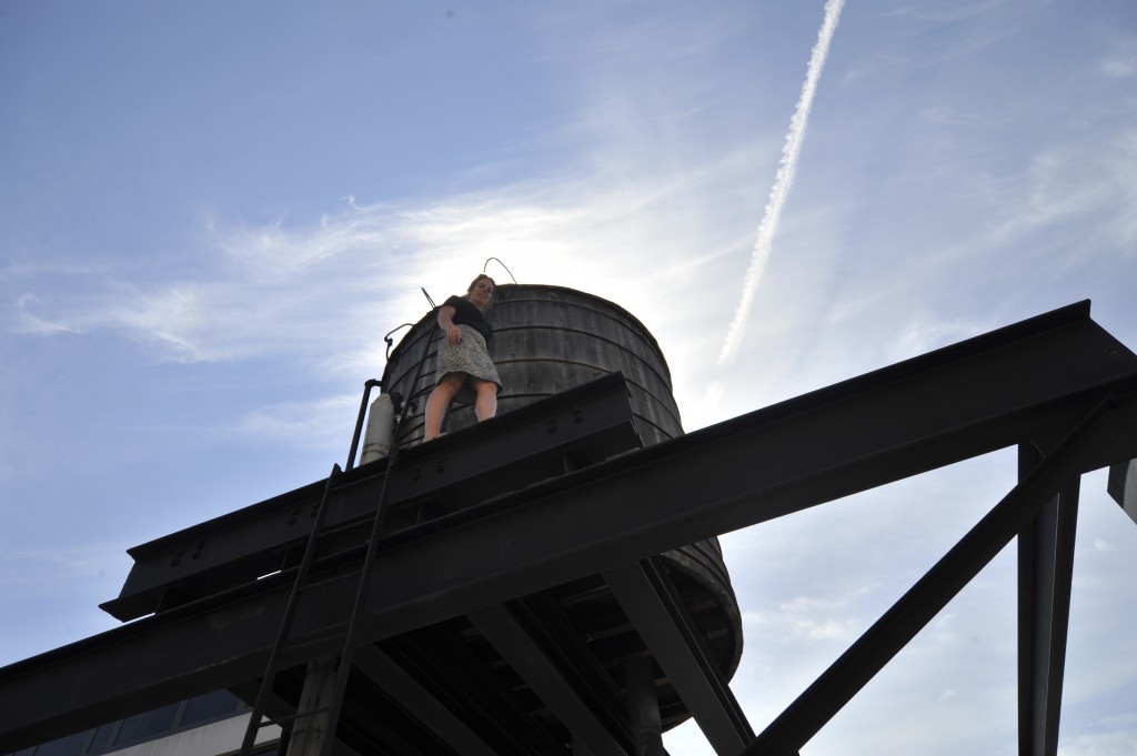 Elizabeth Dooley climbs to new heights on a rickety old water tower to get the ideal shot. 